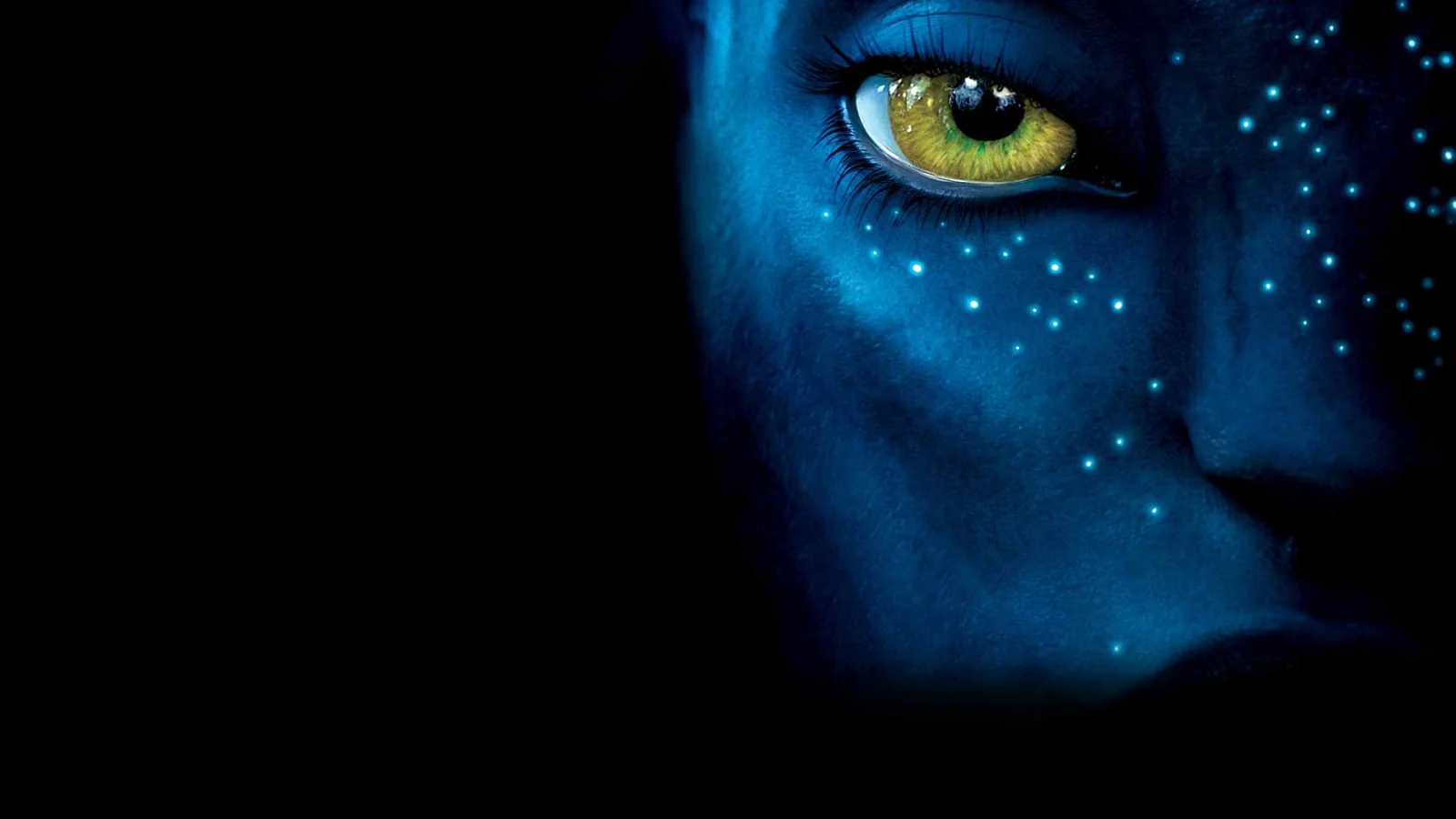Close-up of a blue fantasy character with a green eye